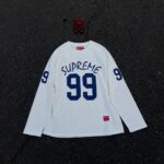 SUPREME 99 L/S  FOOTBALL TOP
