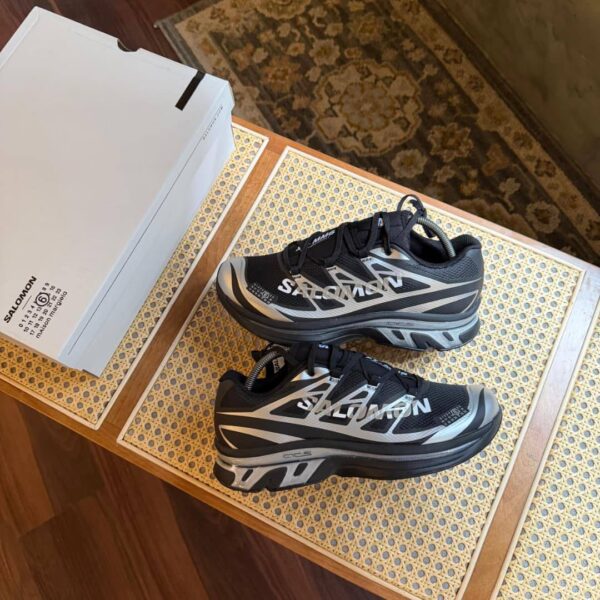 THE SALOMON XT-MM6 MAISON MARGIELA RECONSTRUCTED IN BLACK/SILVER/PHANTOM